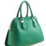 Beautiful elegance and luxury fashion leather green women handbag isolated on white background